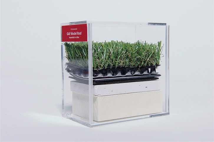 Hands-on roof assembly model made from real and simulated layers in an acrylic box.