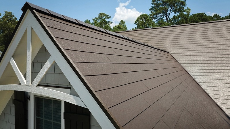 Aerial view of a roof covered in Terra Bronze TimberSteel metal roofing shingles.